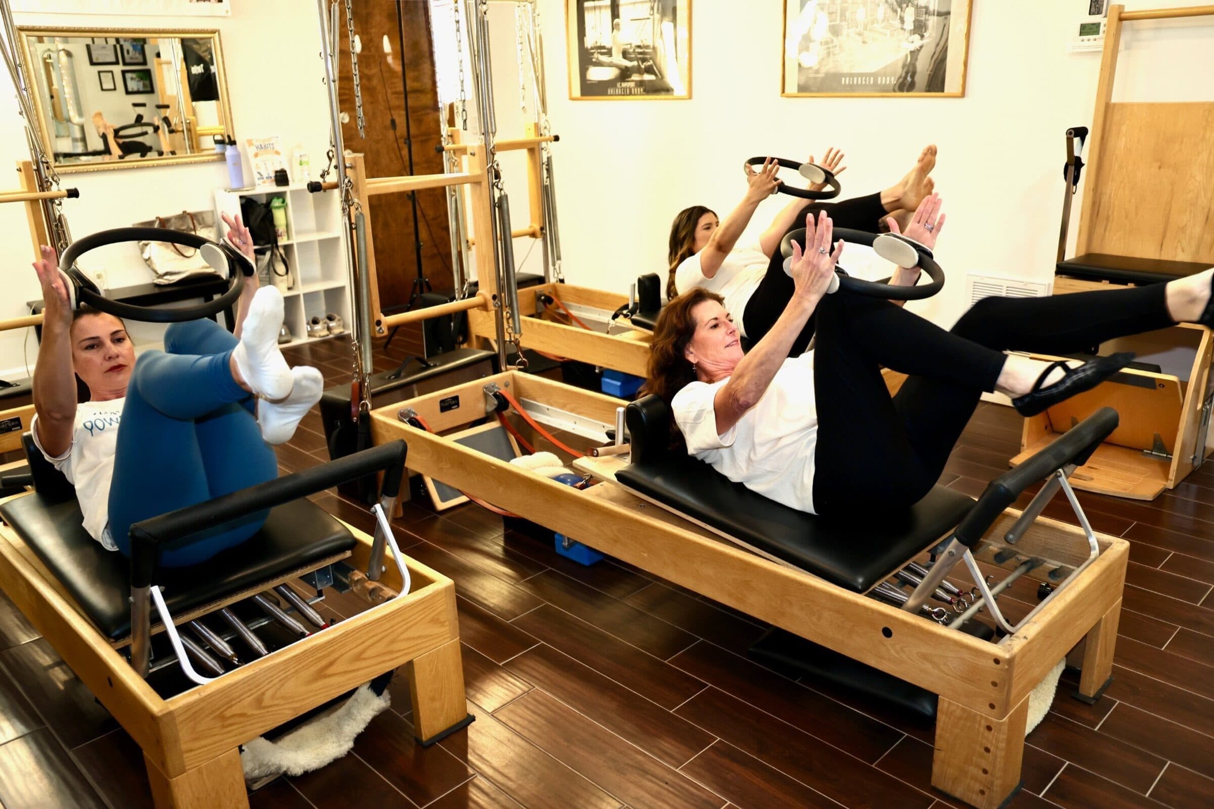 Group class using the magic circle on the Reformer